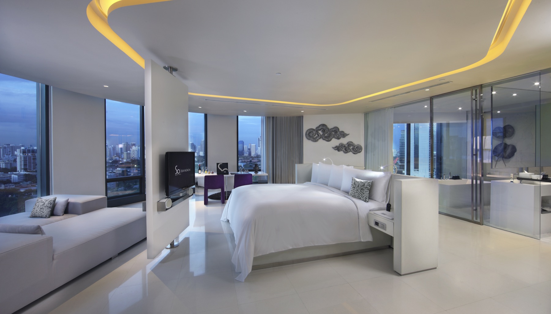A bright SO/ Lofty Metal Element room at SO/ Bangkok with wide floor-to-ceiling windows